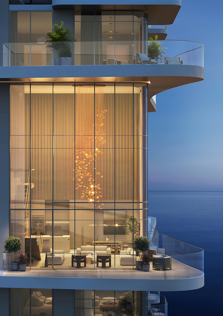 Luxurious apartment with floor-to-ceiling windows, elegant lighting fixture, modern furniture, and ocean view, creating a serene, upscale ambiance.