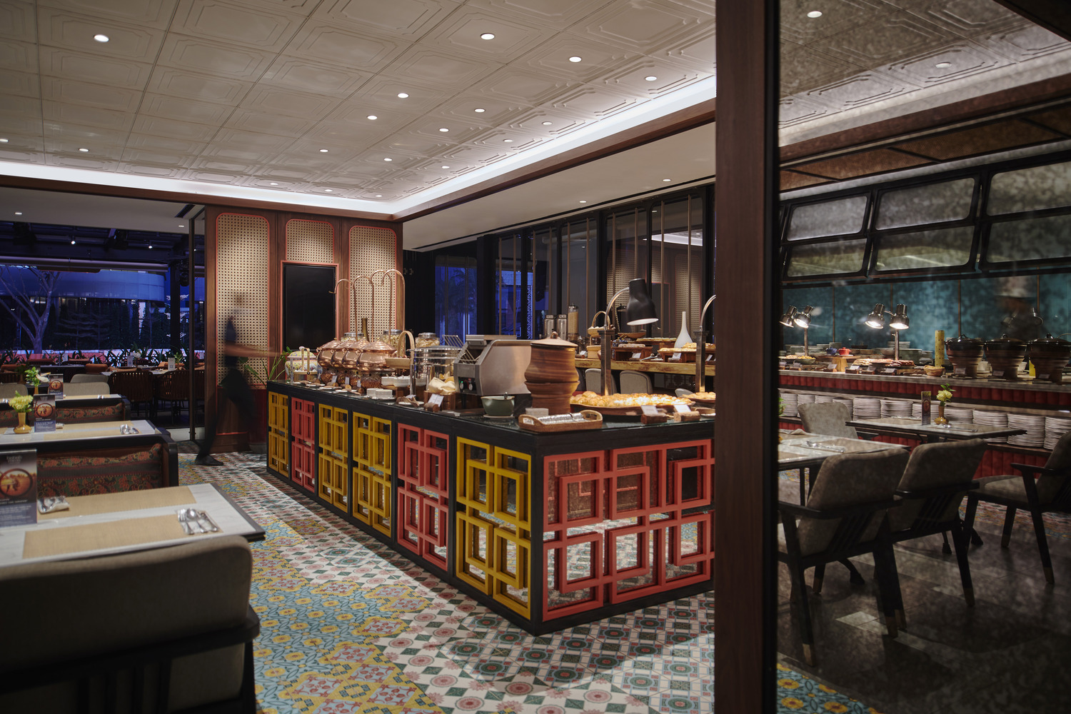 Contemporary restaurant interior with patterned flooring and vibrant detailing by HBA