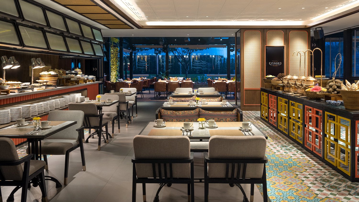 Elegant dining space featuring soft lighting and curated art installations Refined dining area with modern furnishings and warm ambiance