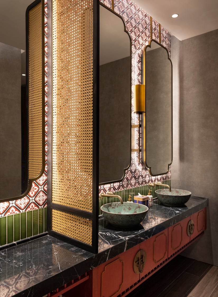 Luxurious powder room with ornate textures and bespoke lighting design