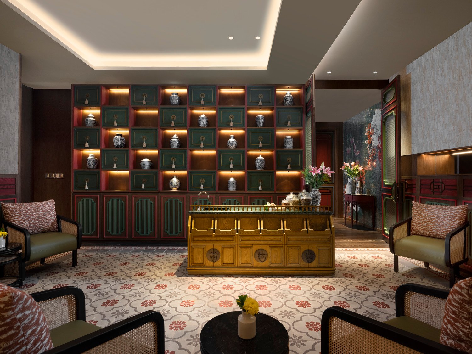Intimate tea lounge with hand-painted mural and tailored seating