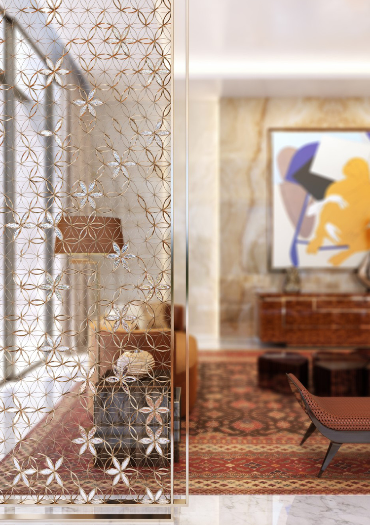 A decorative screen featuring intricate floral patterns, revealing a stylish residential interior with cozy seating and artwork, creating a warm and inviting atmosphere in a luxurious space.