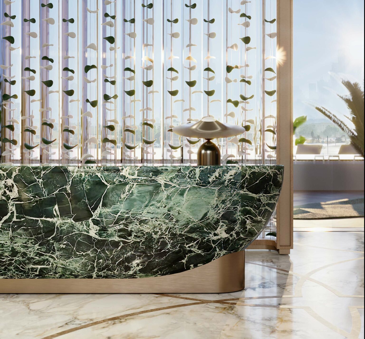 Sleek lobby with a green marble counter, brass lamp, and decorative hanging elements. Sunlight filters through a large window, creating a serene atmosphere.