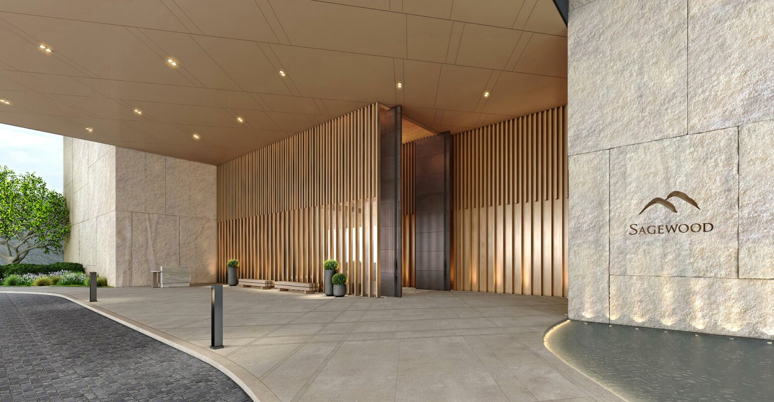 Elegant modern resort building entrance with tall vertical wood paneling, a warm-toned ceiling with recessed lighting, potted plants, and a nearby water feature.