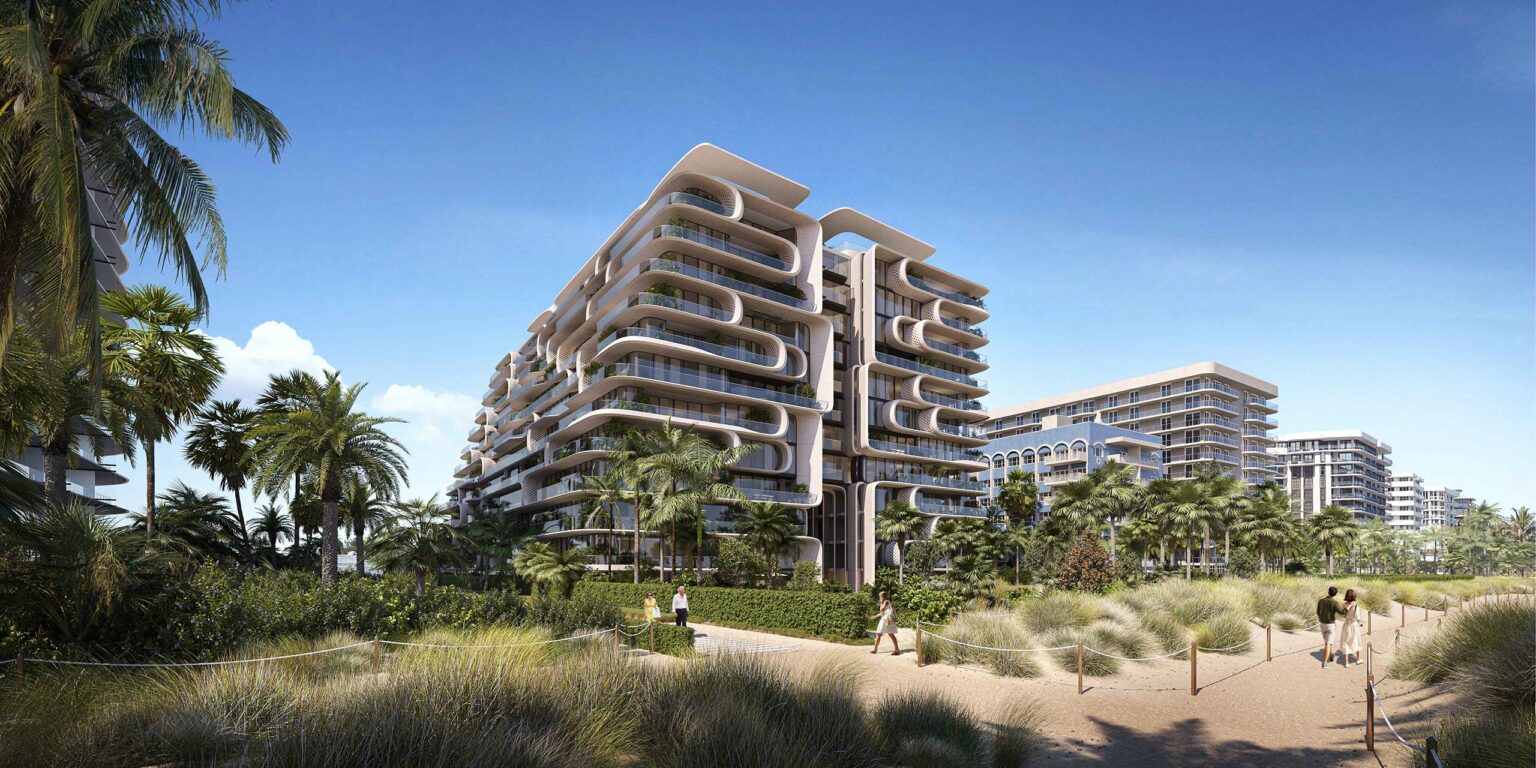 Futuristic beachside apartments with unique rounded architecture, palm trees, and sandy paths under a clear blue sky convey a modern, relaxed vibe.