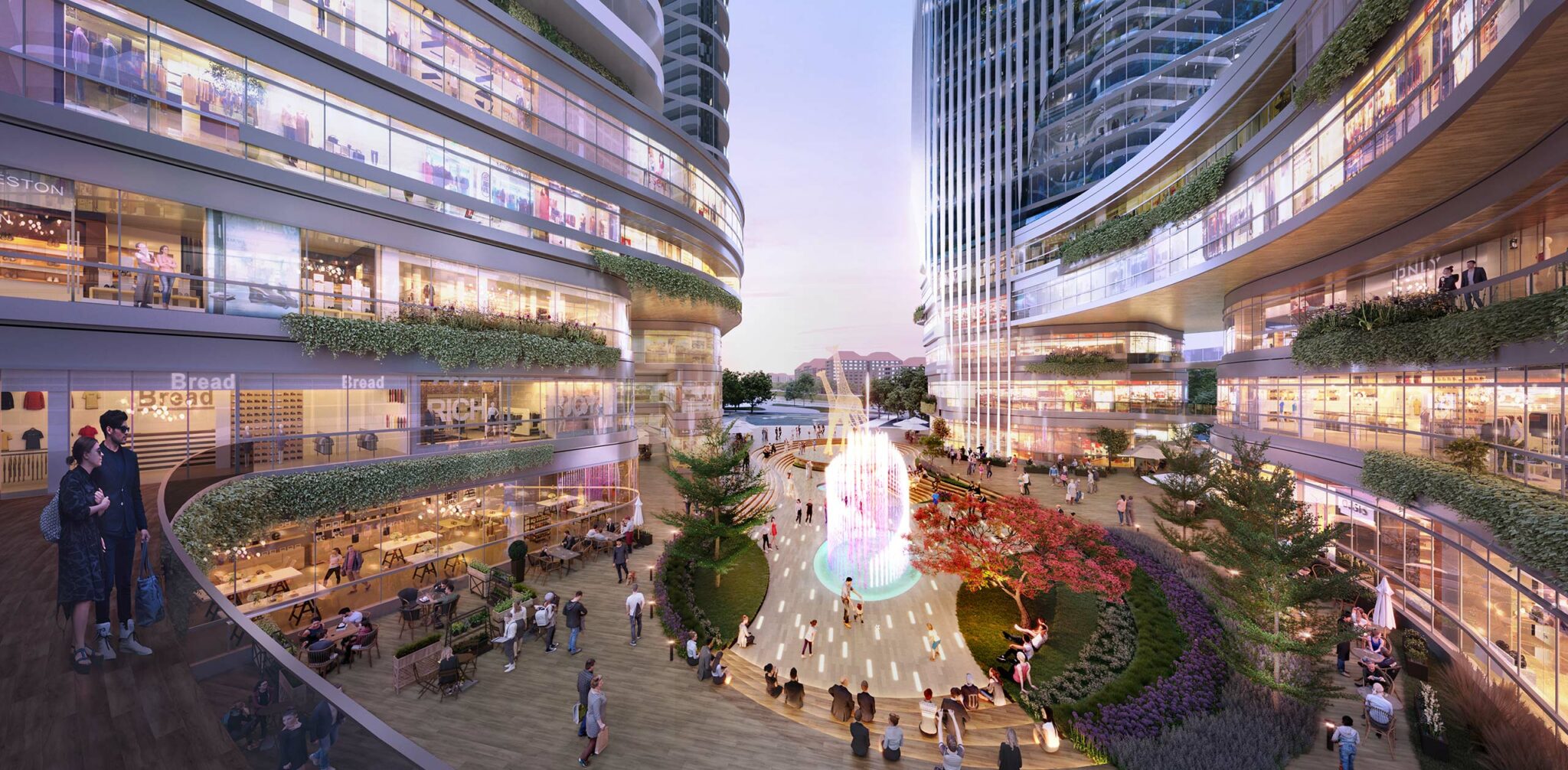 Modern urban plaza with curved glass buildings and lush greenery. A central illuminated fountain glows at dusk, surrounded by people and cafes, exuding a lively ambiance.