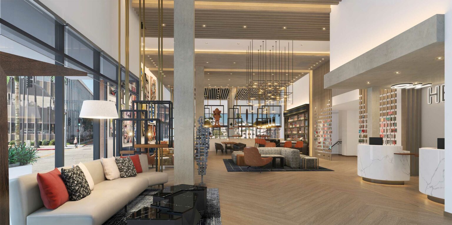 Modern hotel lobby with tall ceilings, warm lighting, and elegant decor. Features plush seating, contemporary art, and a welcoming atmosphere.