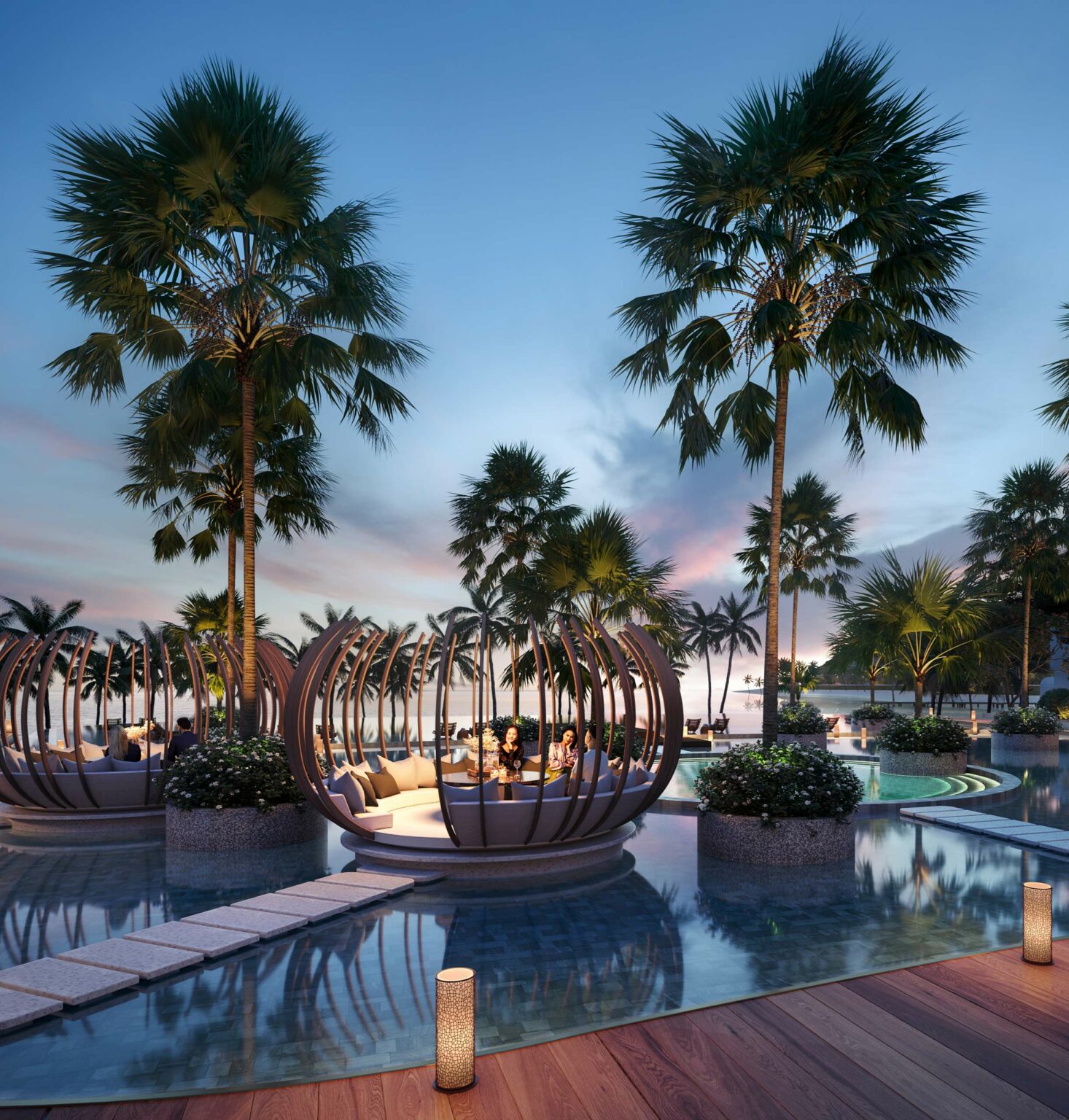 Tropical hotel at sunset with people dining in open, spherical lounges surrounded by water. Palm trees and vibrant sky create a serene atmosphere.