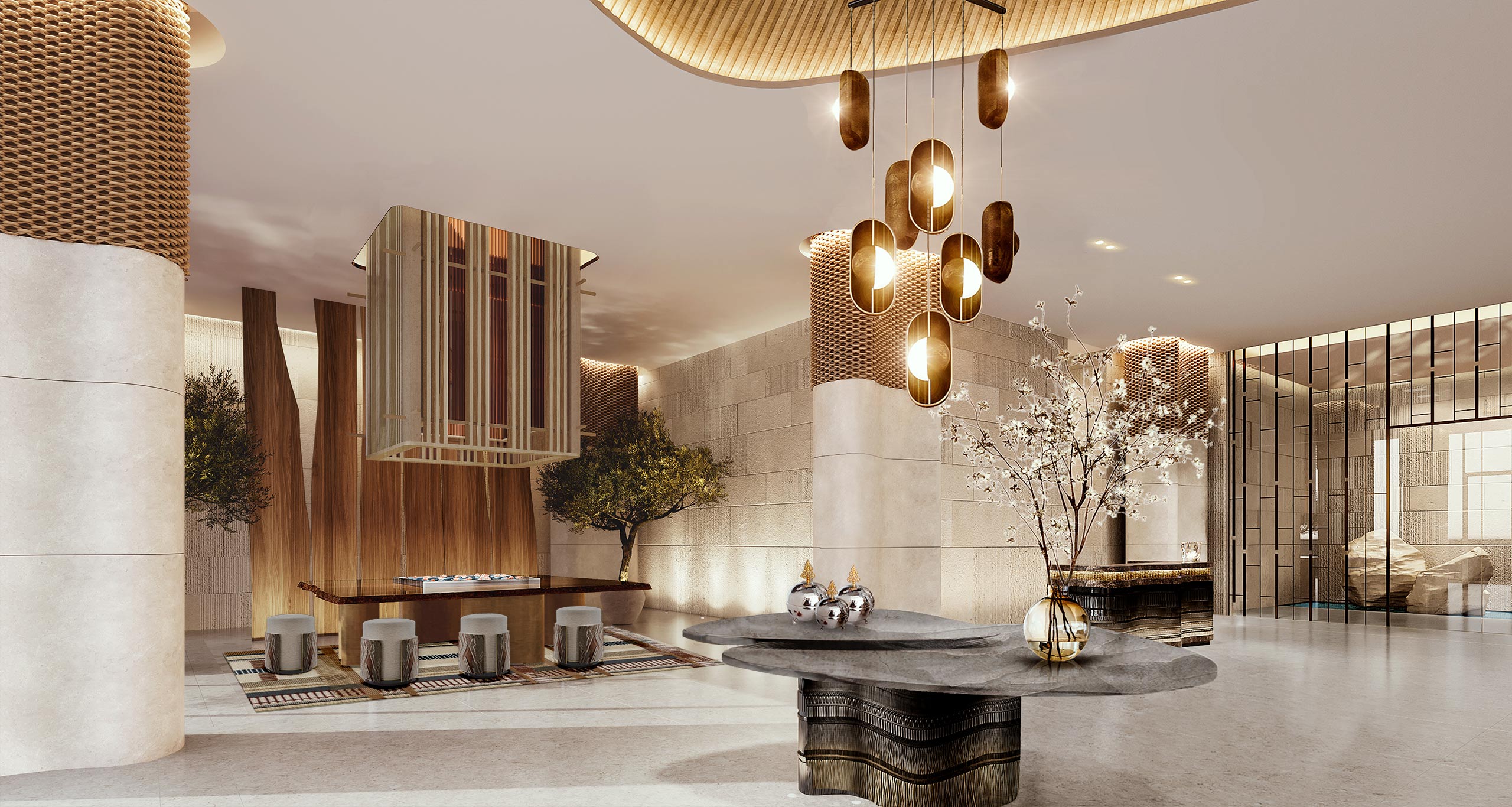 Elegant residential lobby with modern decor, featuring large pendant lights, wooden accents, seating area with stools, and floral arrangements on tables. Warm, inviting atmosphere.