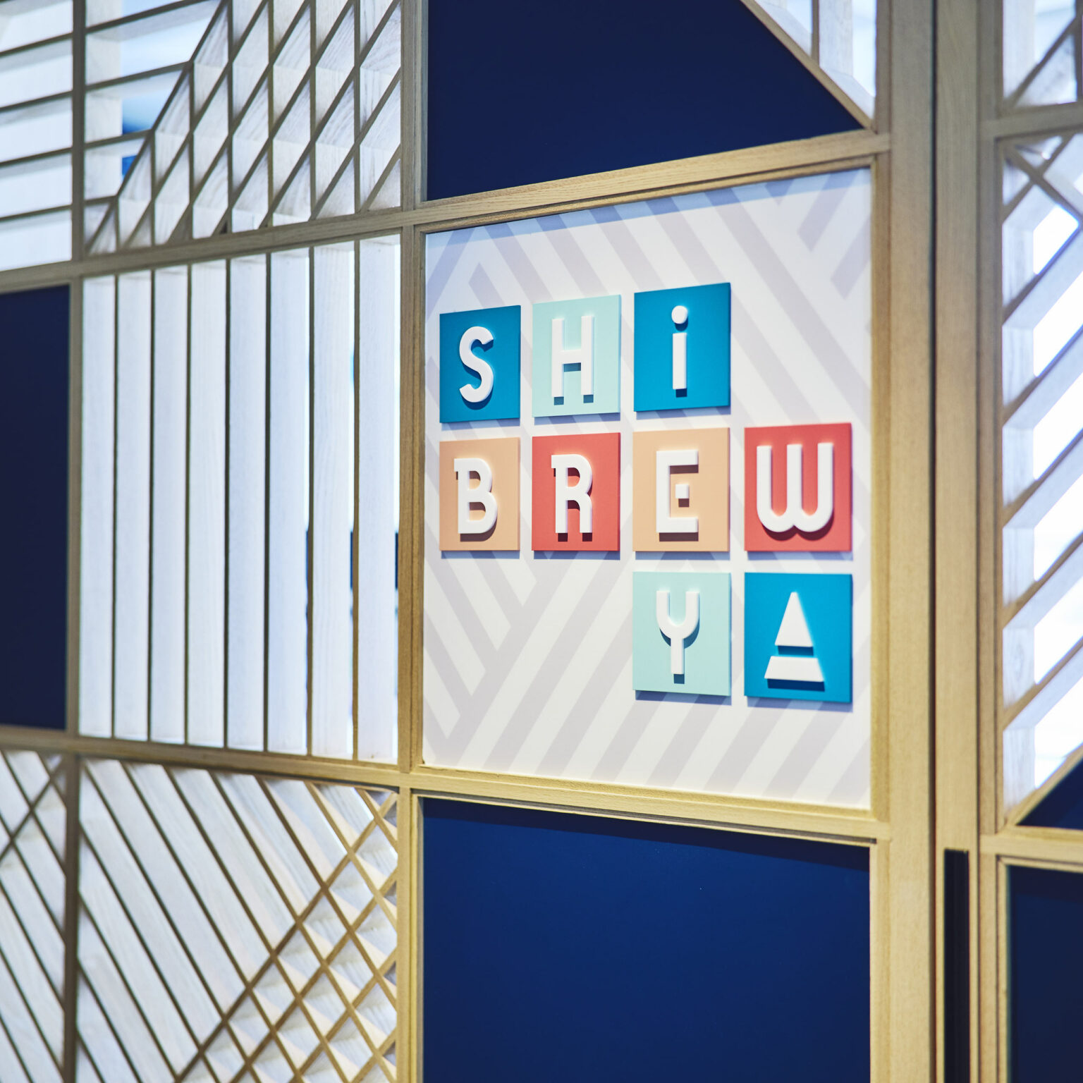Colorful wall art features playful 3D letters spelling 