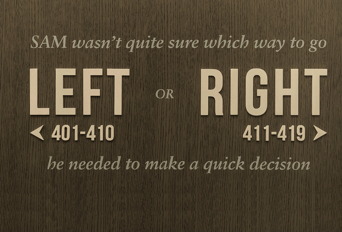 Sign on a textured hotel wall reads: 