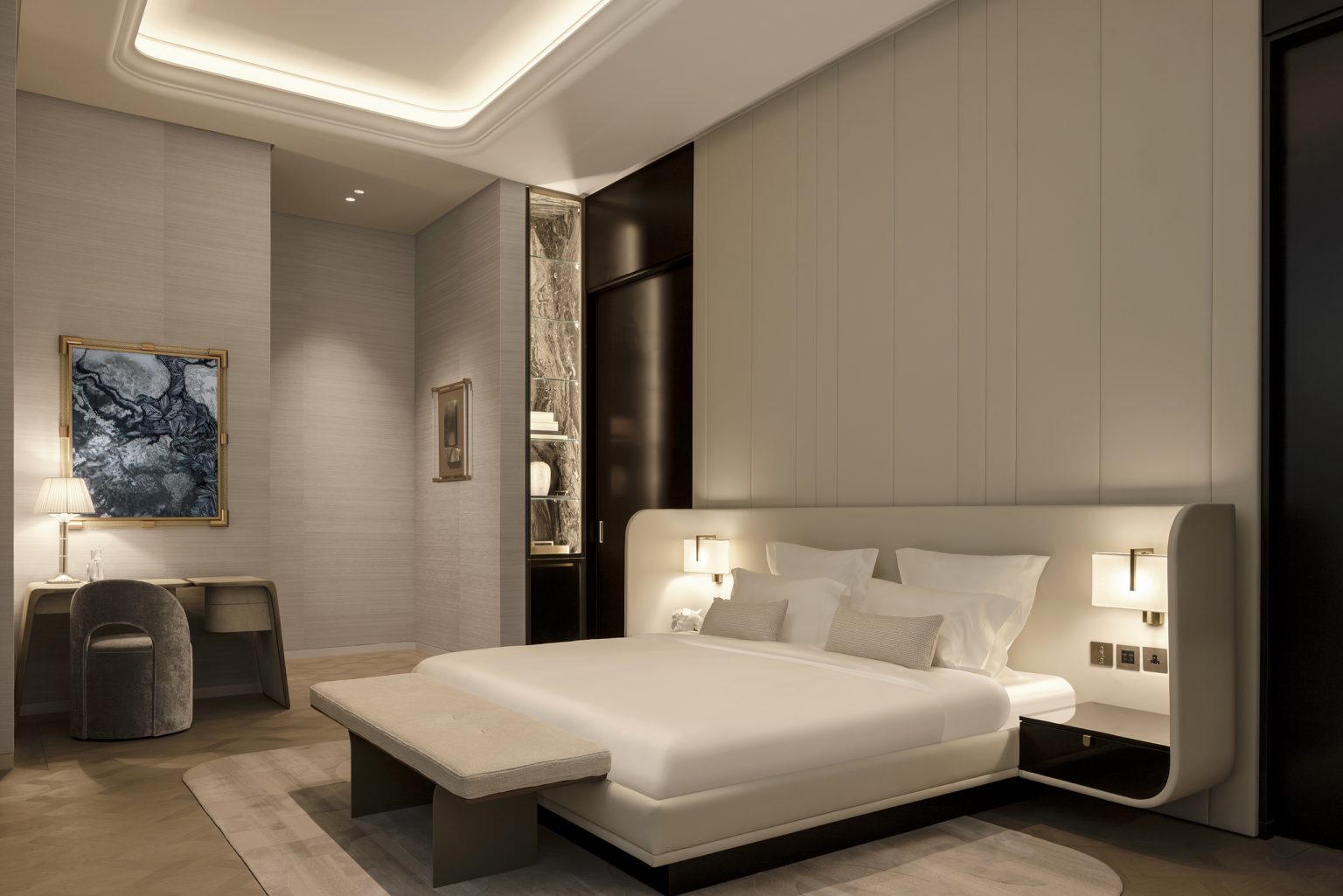 A contemporary luxurious bedroom in Waldorf Astoria Residences Dubai with a lavish bed and an impressive large mirror, reflecting a sense of opulence and tranquility.
