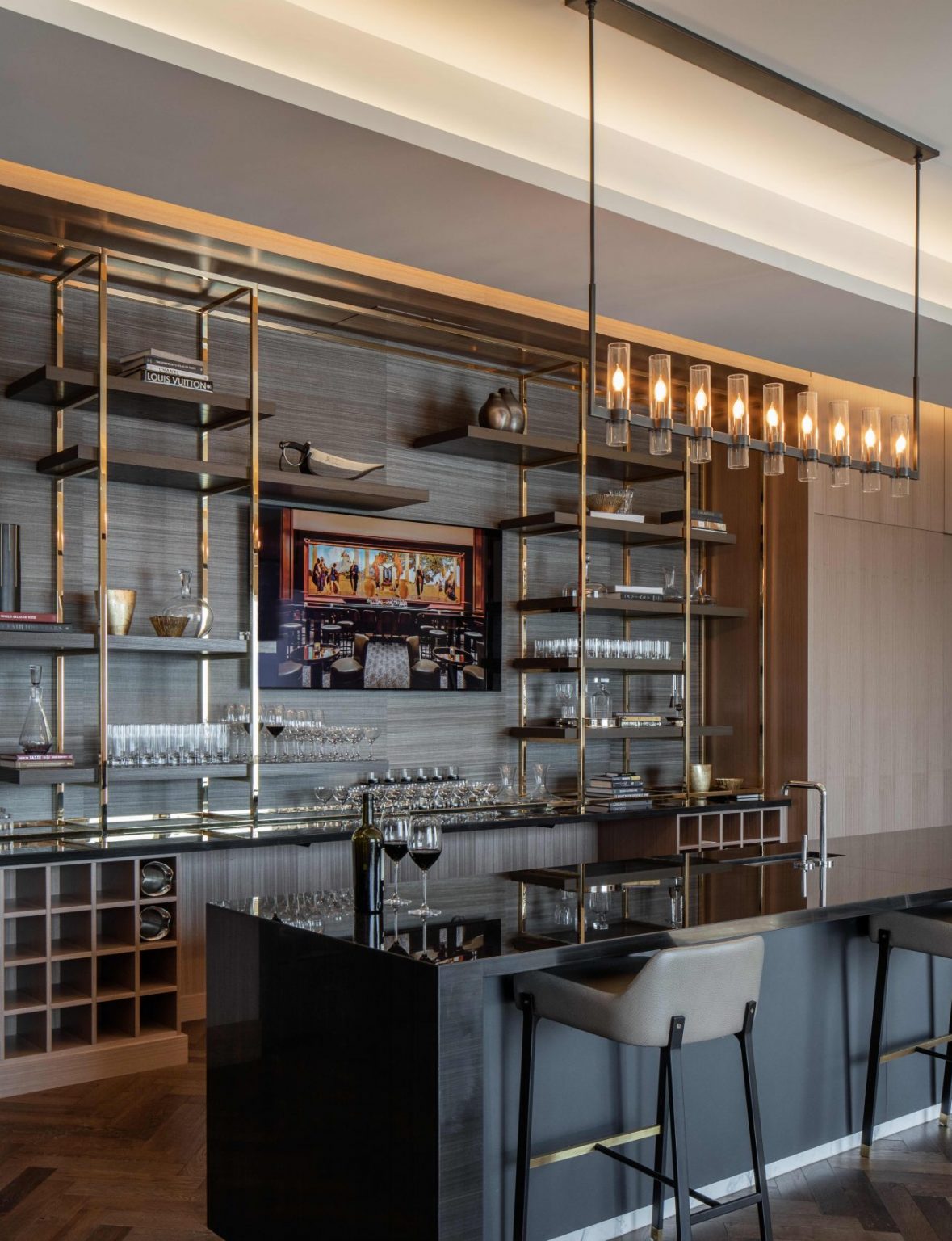 Elegant modern restaurant interior within a luxurious resort featuring geometric ceiling lights, wooden floors, and stylish beige chairs around round tables, creating a warm, inviting ambiance.