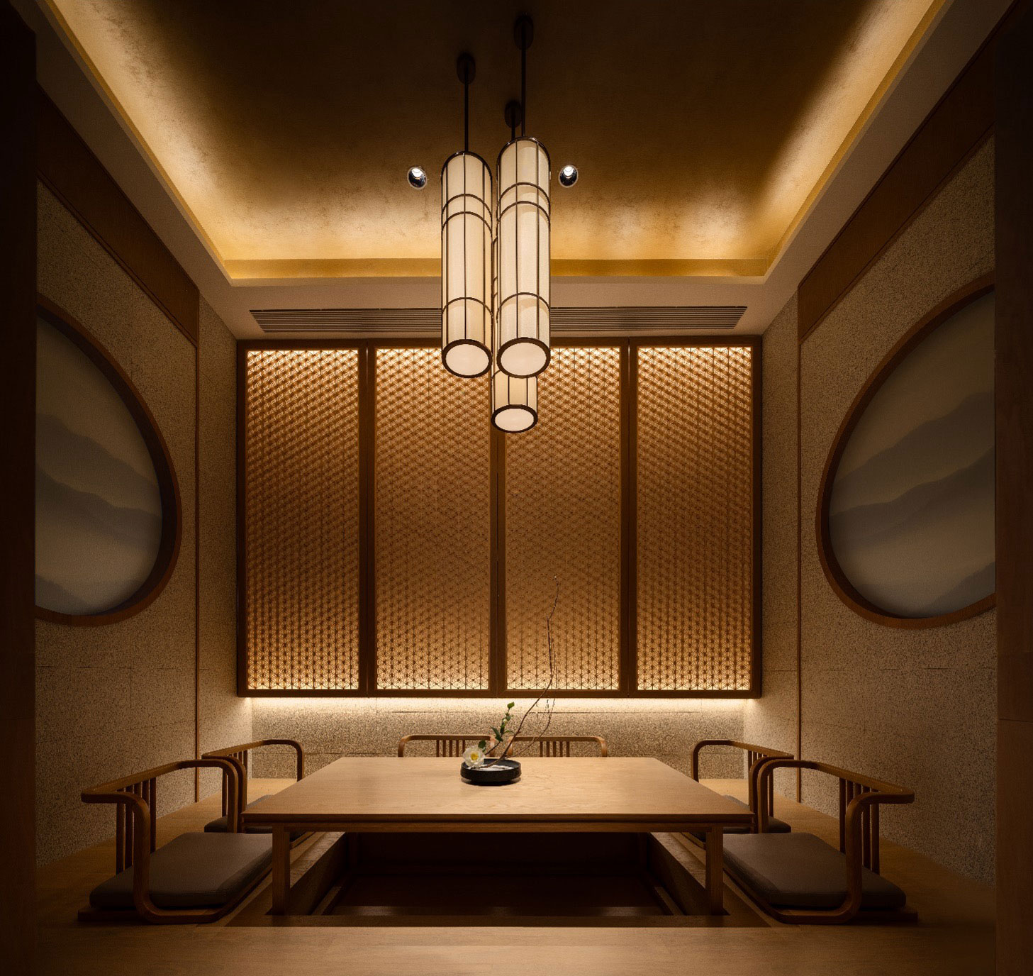 Elegant hotel dining room with warm lighting, featuring a wooden table, minimalist chairs, and a modern centerpiece. Ambient, serene atmosphere with a Japanese-inspired design.