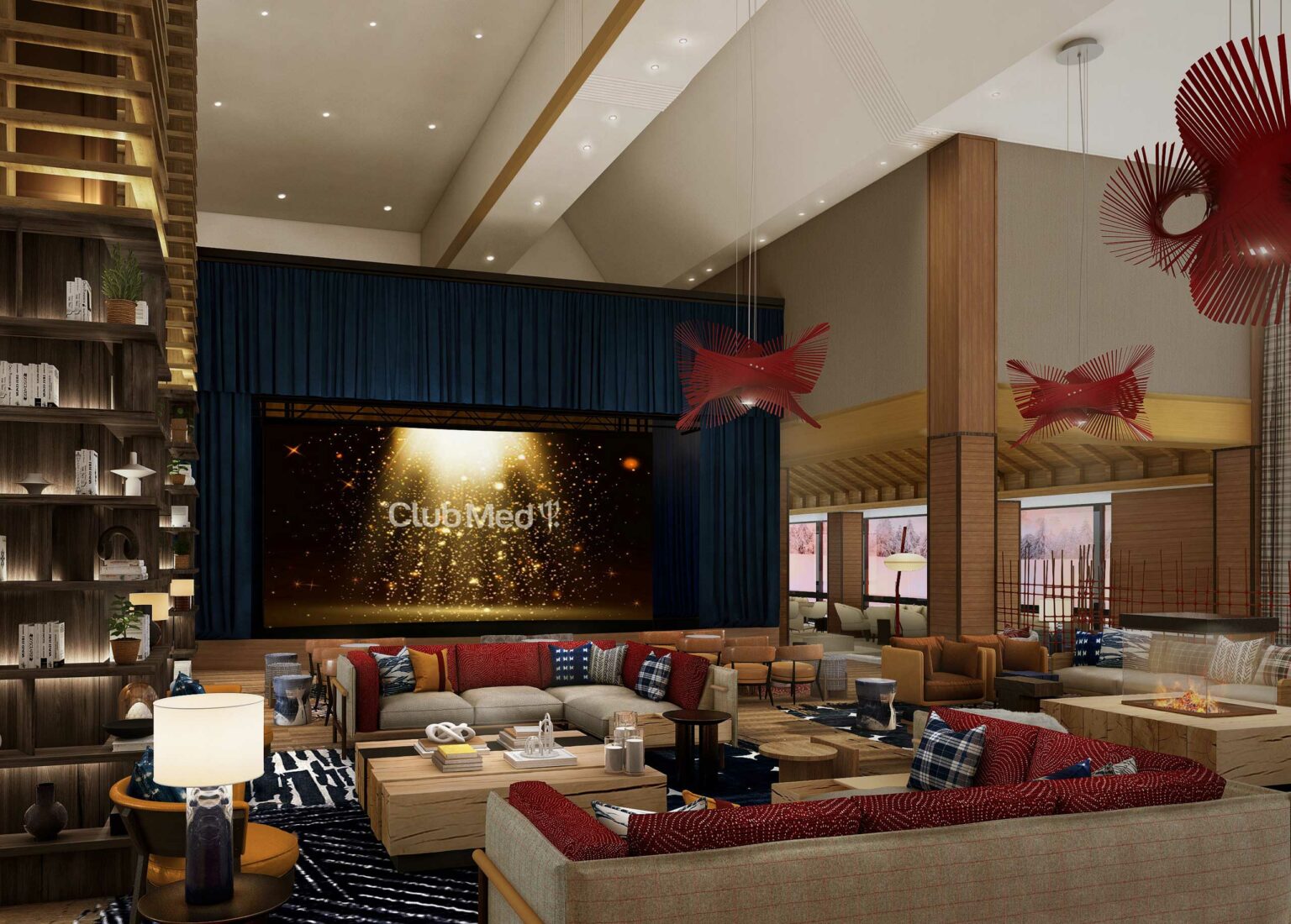 Spacious hotel lounge with high ceilings, modern decor, and warm lighting. A large screen displays 
