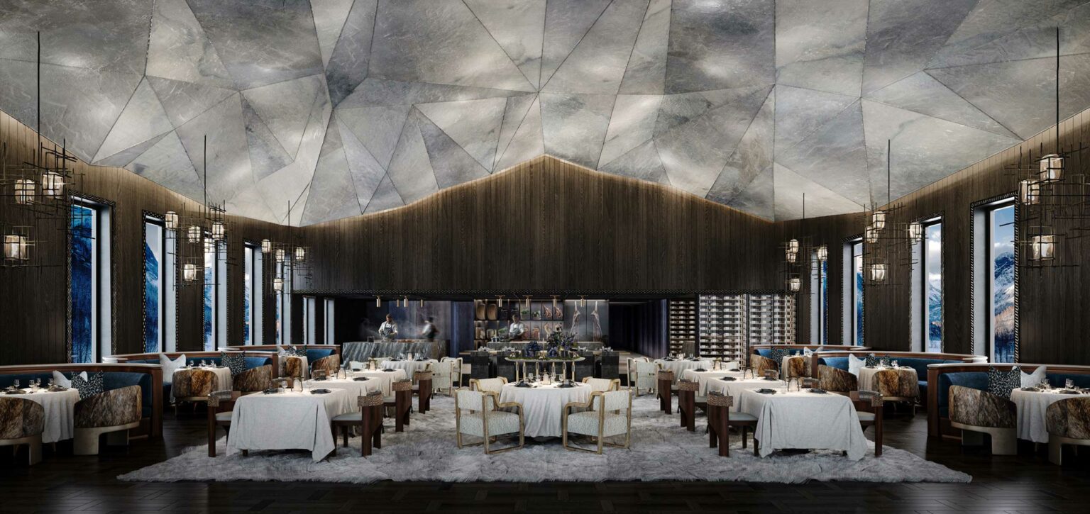 Luxurious hotel restaurant with high, geometric ceiling, elegant chandeliers, and large windows. Tables are set with white linens, creating an upscale ambiance.