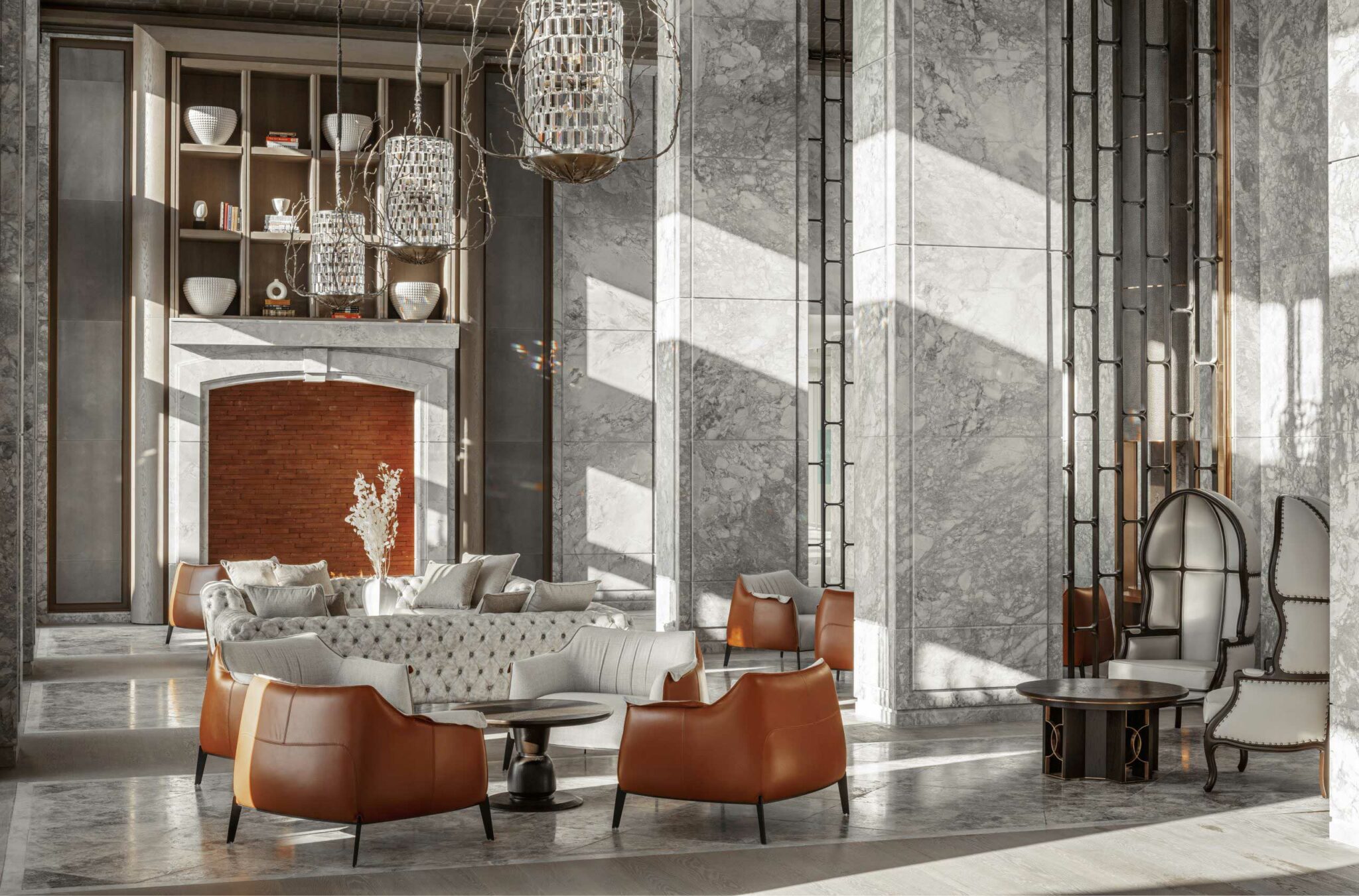 Luxurious resort lobby with modern design. Marble walls, elegant chandeliers, brown leather chairs, and cozy beige couches create a warm, sophisticated ambiance.