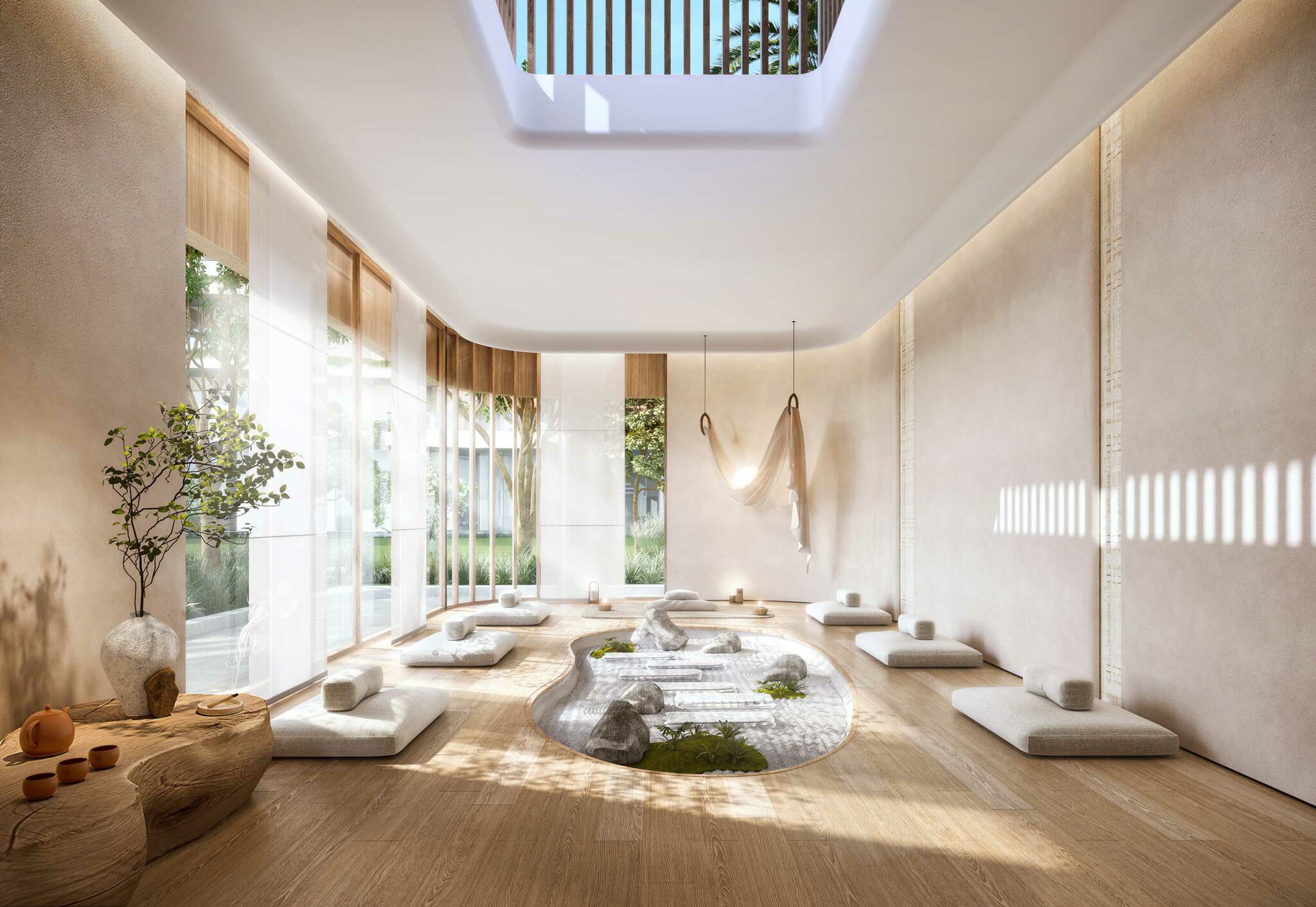 A serene, minimalist resort wellness communal area with soft cushions encircling a central pebble and moss garden. Sunlight filters through a skylight and large windows, creating a peaceful atmosphere.