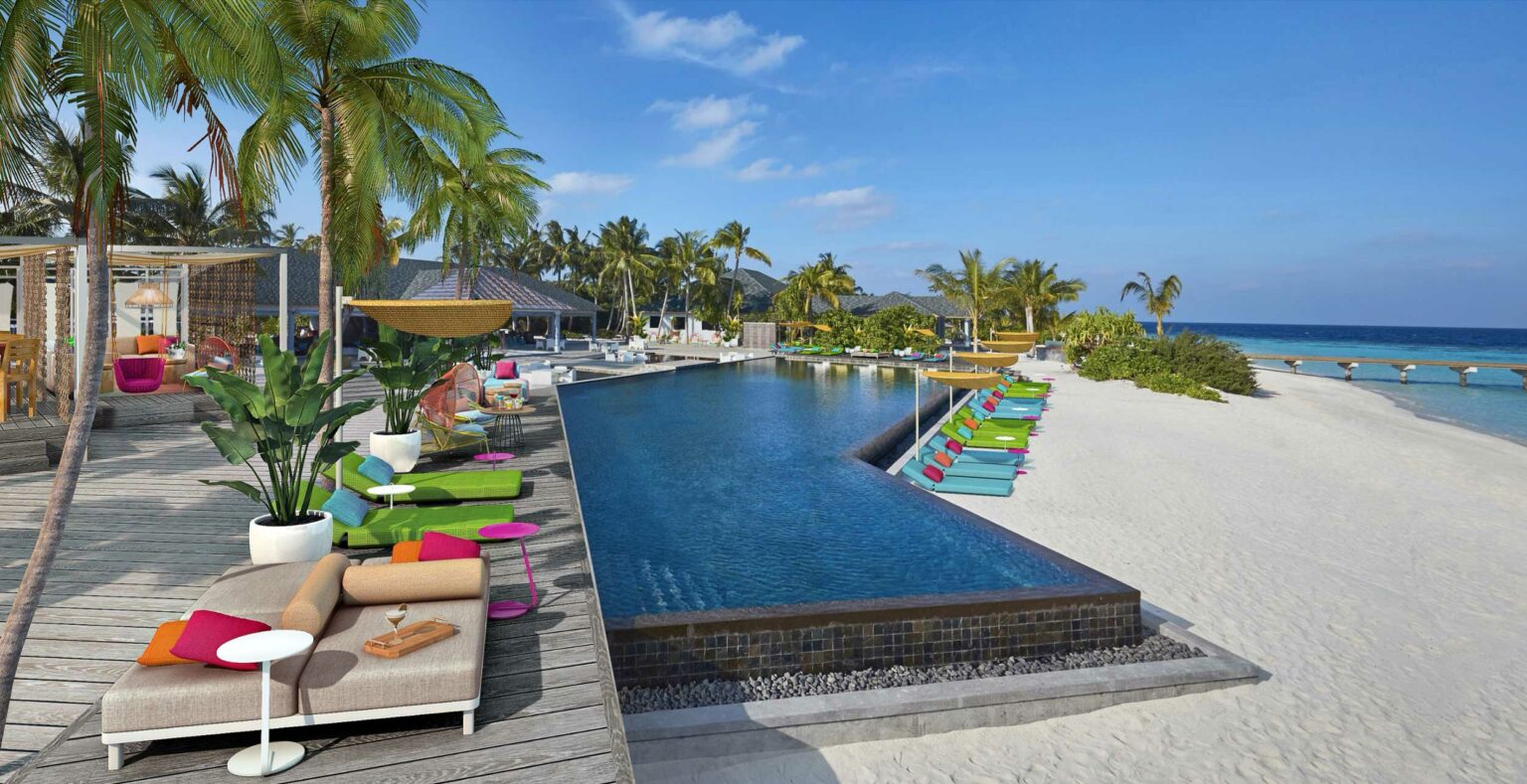 Luxurious beachside resort with a sparkling pool, colorful lounge chairs, and lush palm trees, creating a vibrant and relaxing tropical ambiance.