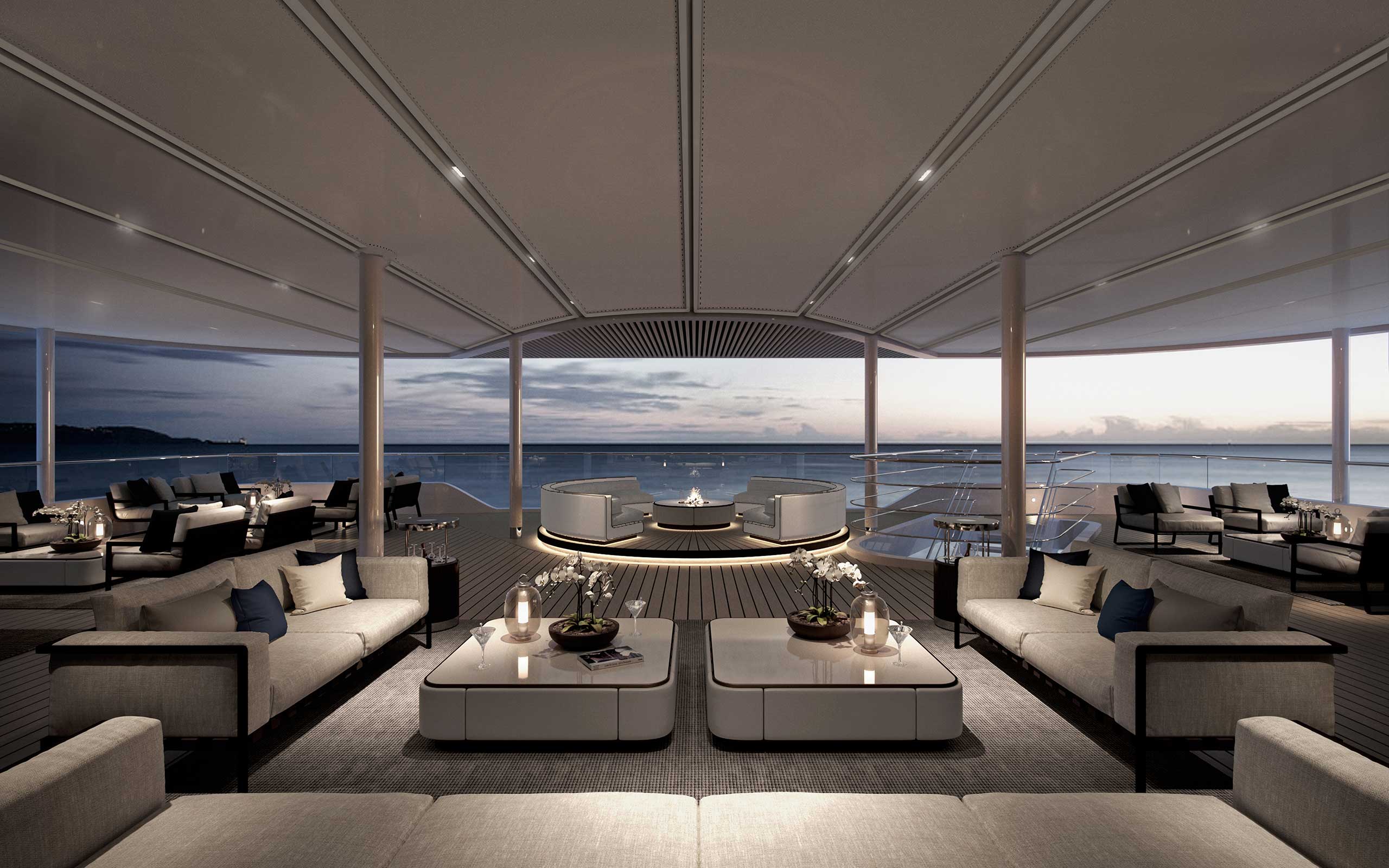 A luxurious, contemporary cruise deck looking out to sweeping ocean views.