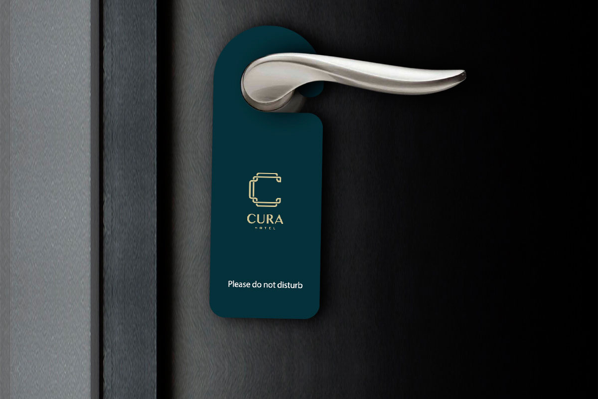 A sleek, silver door handle on a dark door with a blue 