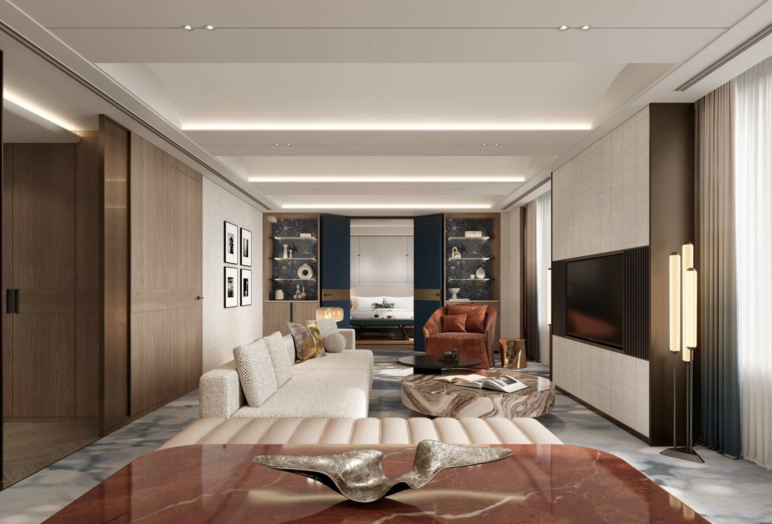 Modern suite living room with a beige sofa, abstract art, and a marble coffee table. Warm lighting and wooden accents create a cozy atmosphere.
