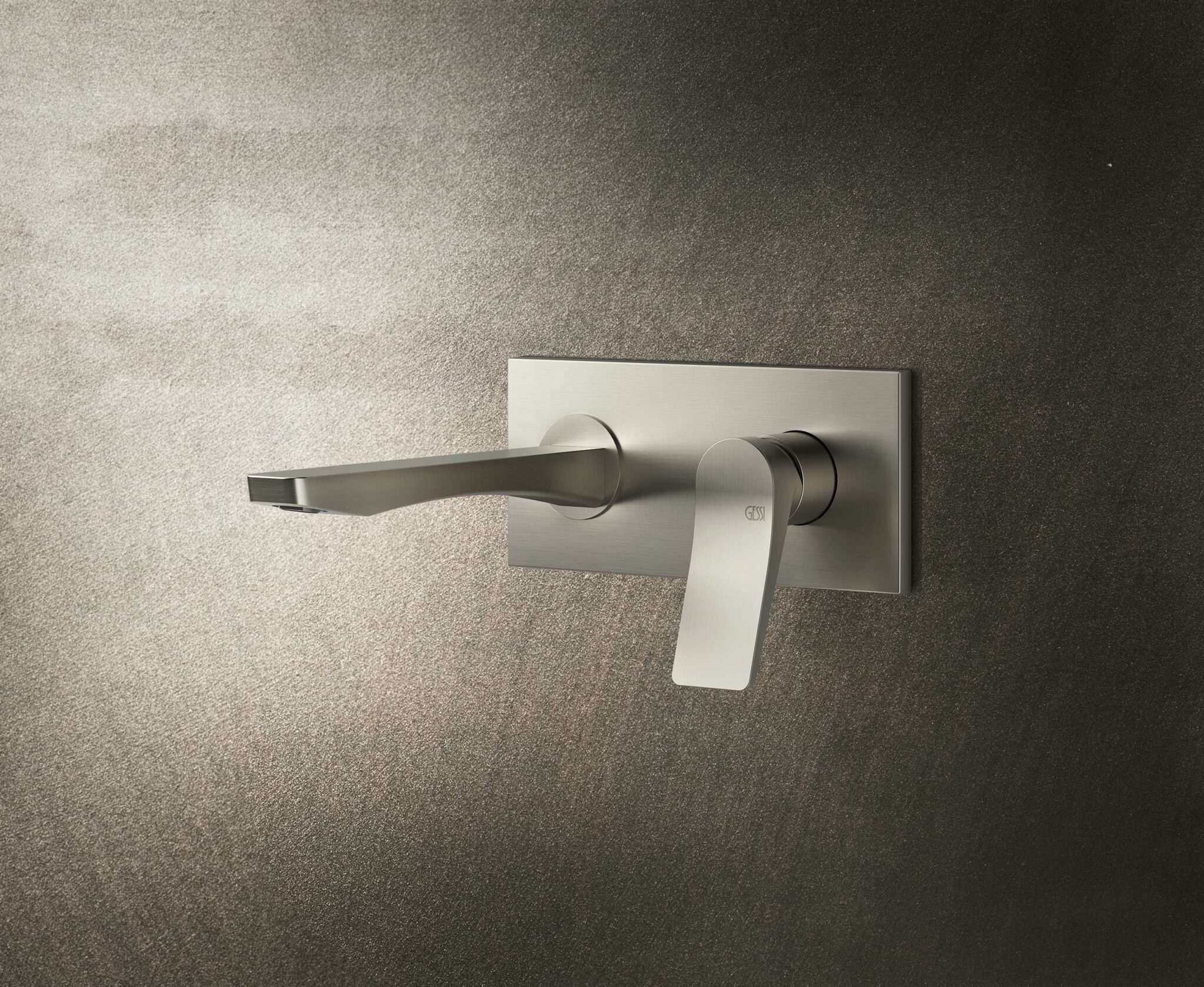 Sleek brushed stainless steel faucet with rectangular base on textured gray wall. Modern design, minimalistic aesthetic, conveying elegance and sophistication.