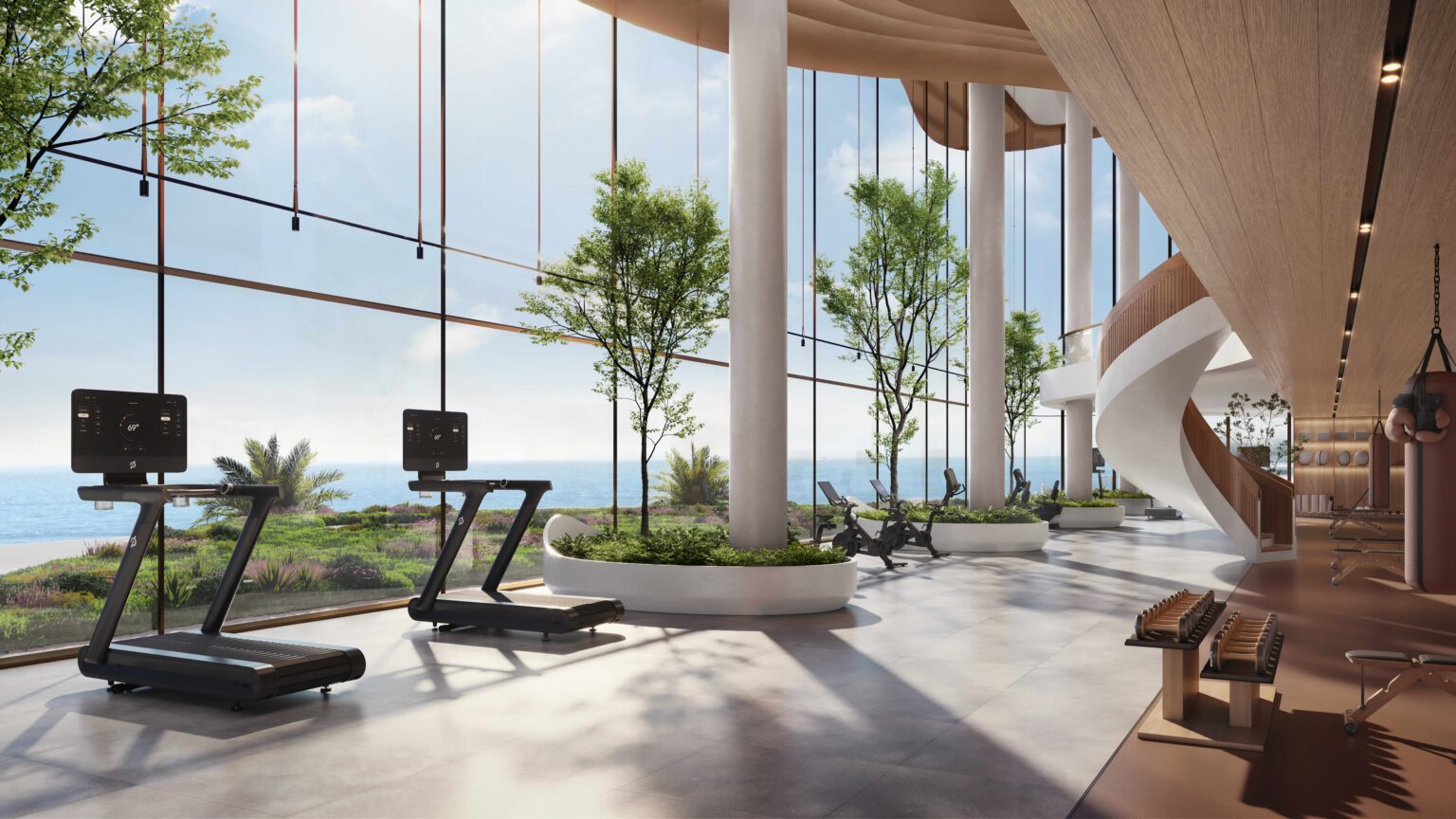 Modern gym interior with large windows showing ocean view, treadmills, exercise bikes, plants, and a spiral staircase. Bright, open, and serene atmosphere.