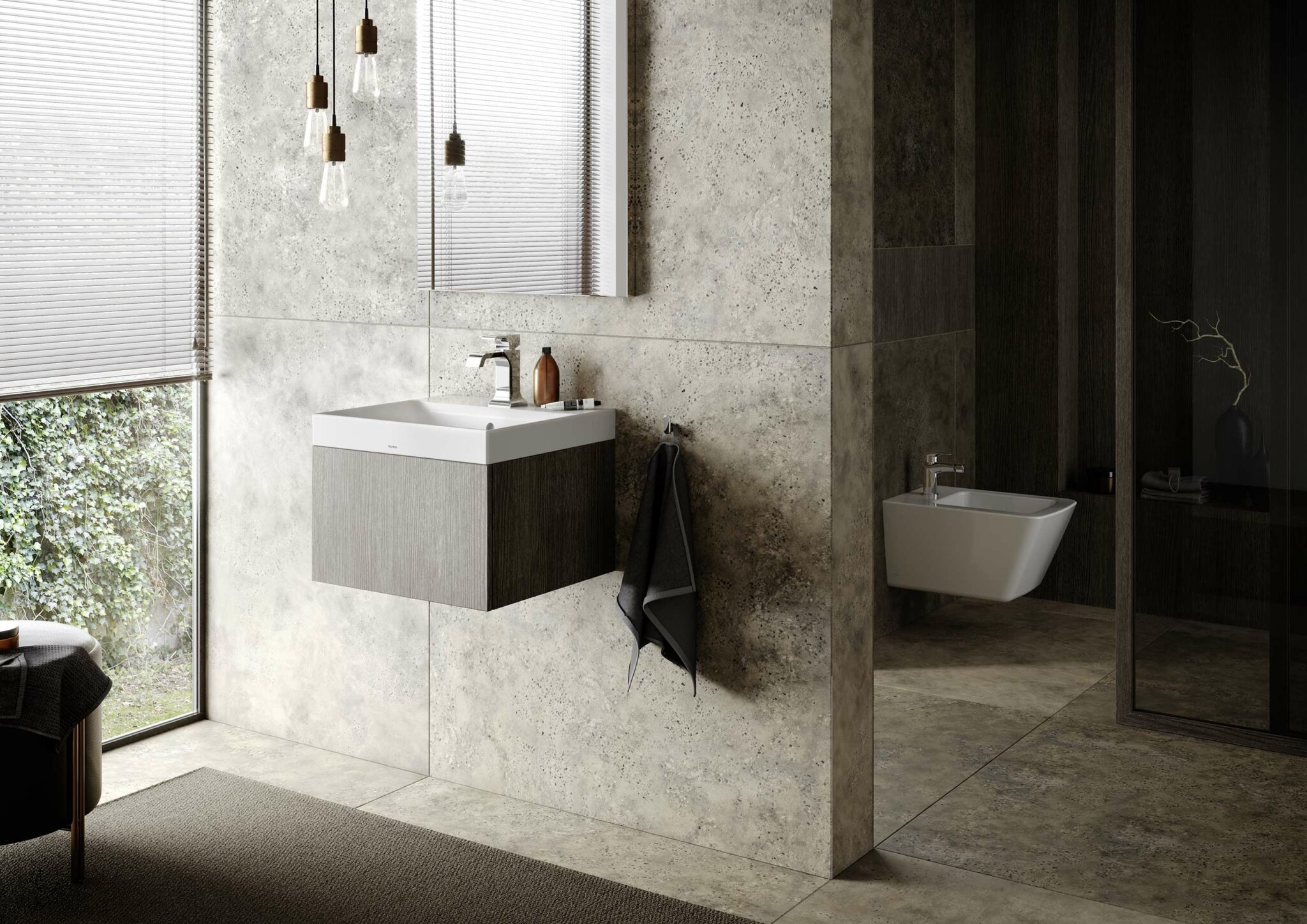 Modern bathroom with stone tile walls, a sleek sink with a wooden cabinet, and hanging lights. Large window with blinds, and a white toilet on the right.
