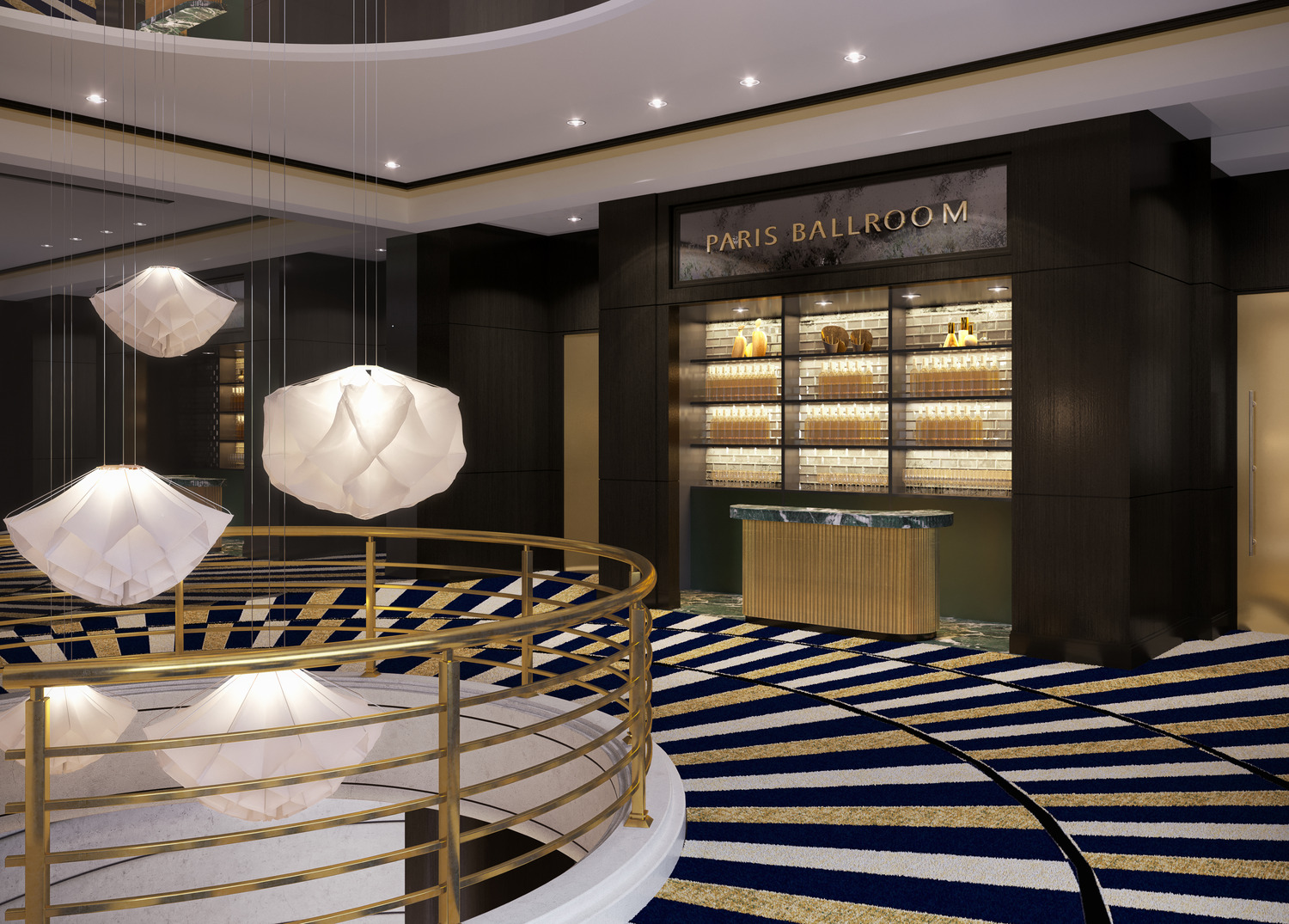 A grand circular lobby showcases a bold marble floor medallion, fluted columns, and a striking zebra-patterned reception backdrop.