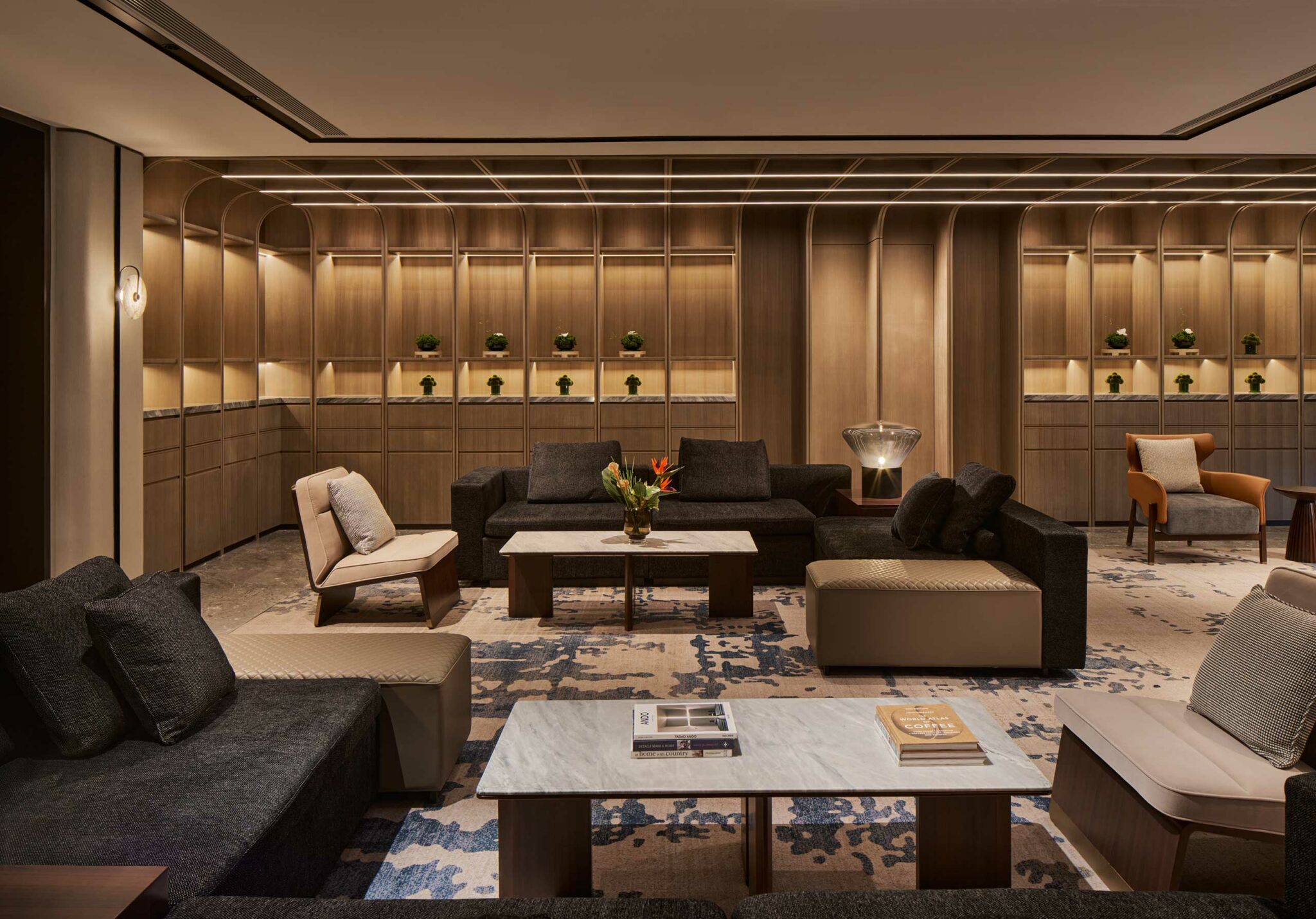 Hilton Shanghai Zhangjiang Science City lobby lounge with modern sofas, marble coffee tables, wood panel walls, and luxury interior design