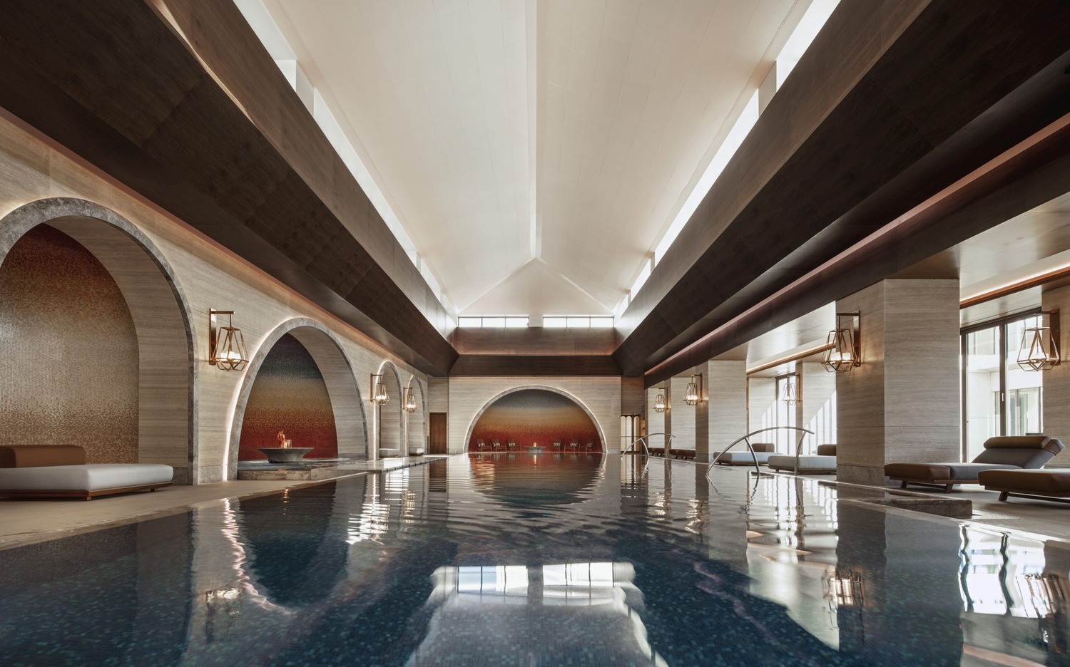 Luxurious resort spa interior with arched golden doorways and marble walls. A person in a white robe walks through the opulent, serene hallway.