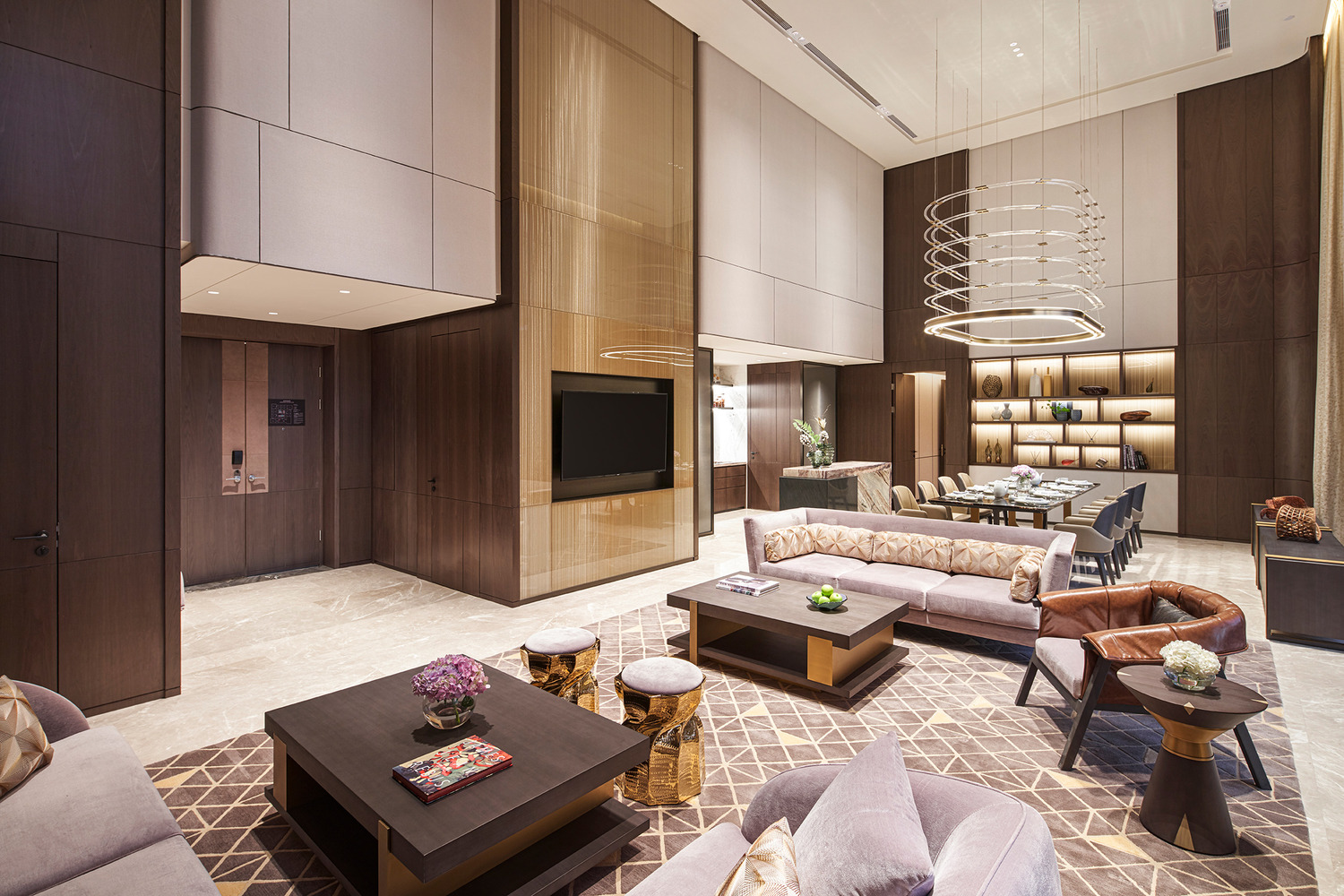 Modern hotel lobby with a sleek marble reception desk, vibrant teal and red shelving, elegant lighting, and a lush indoor tree. The space conveys luxury.