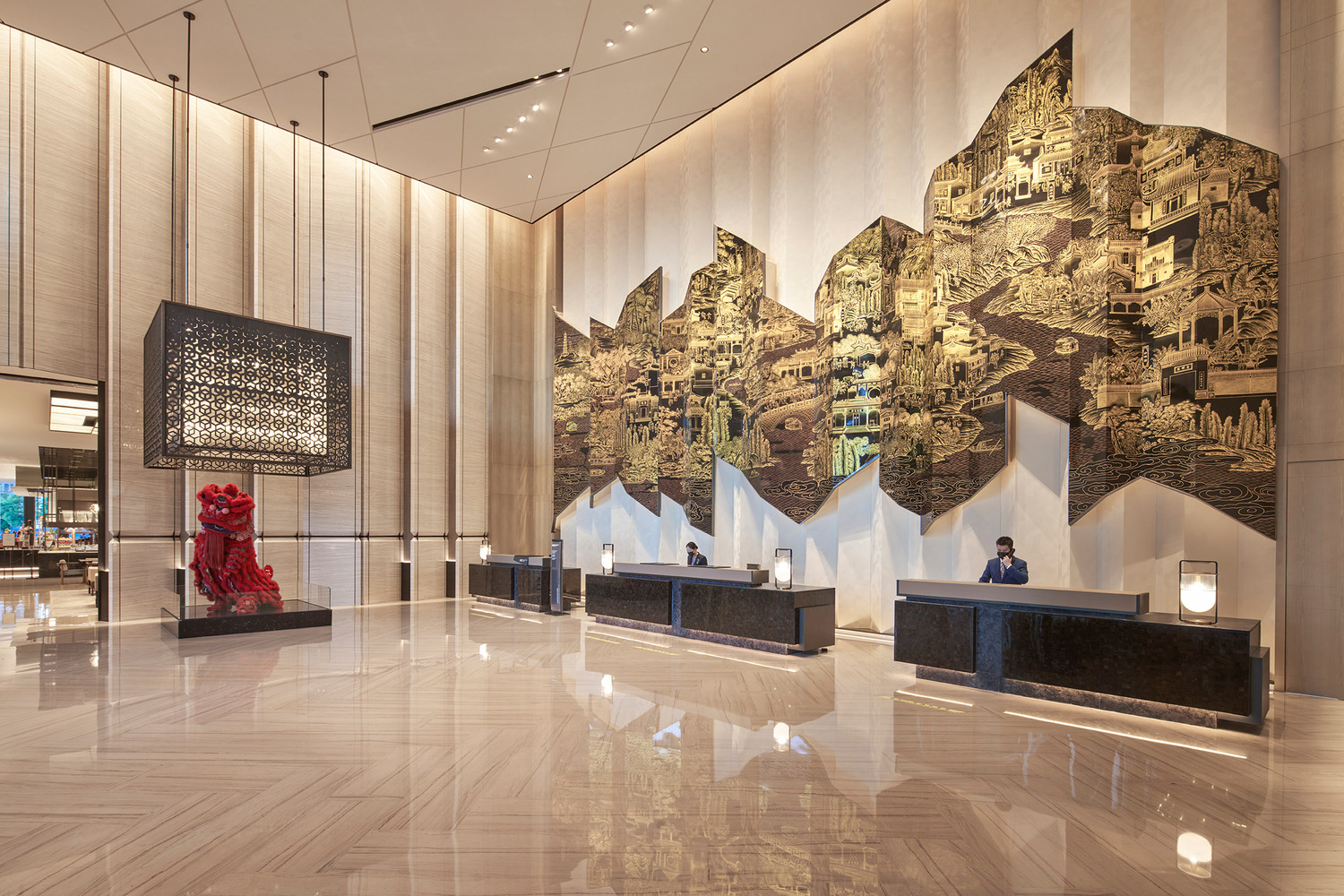 Modern hotel lobby with a sleek marble reception desk, vibrant teal and red shelving, elegant lighting, and a lush indoor tree. The space conveys luxury.