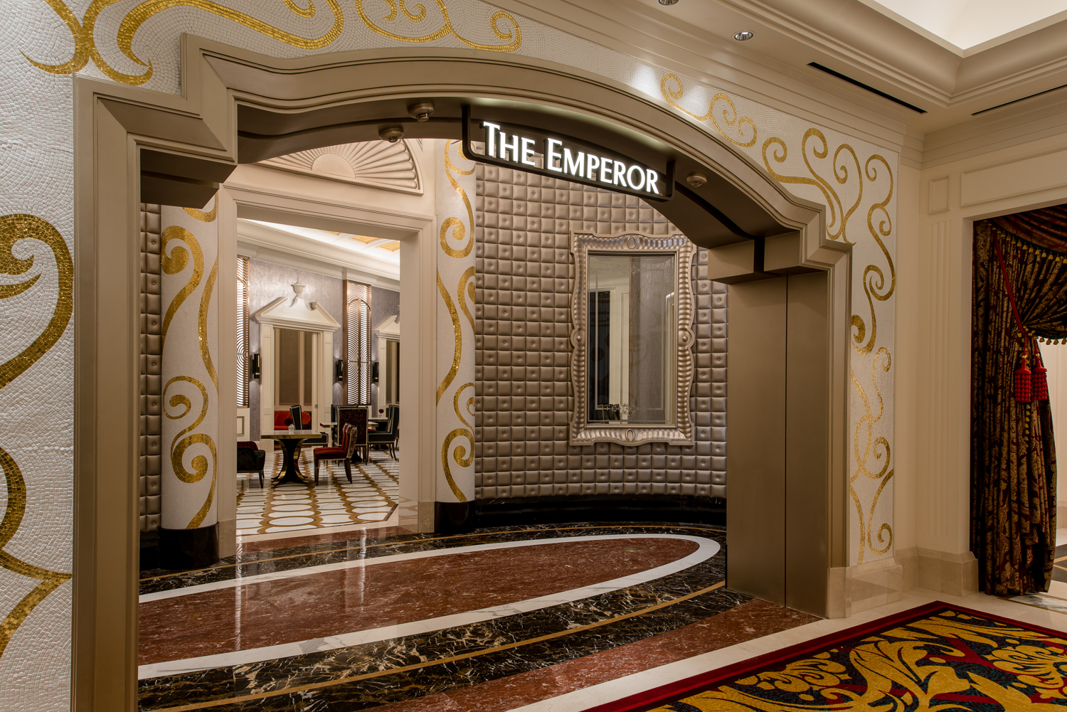 A vibrant casino interior featuring luxurious chandeliers, colorful slot machines, and stylish gaming tables, creating an energetic and glamorous atmosphere for guests seeking entertainment and excitement.