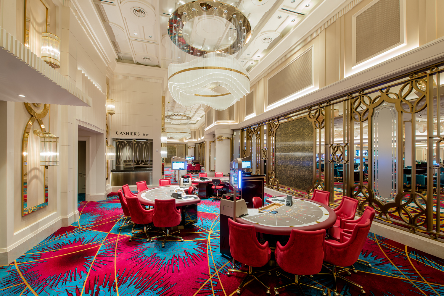 A vibrant casino interior featuring luxurious chandeliers, colorful slot machines, and stylish gaming tables, creating an energetic and glamorous atmosphere for guests seeking entertainment and excitement.