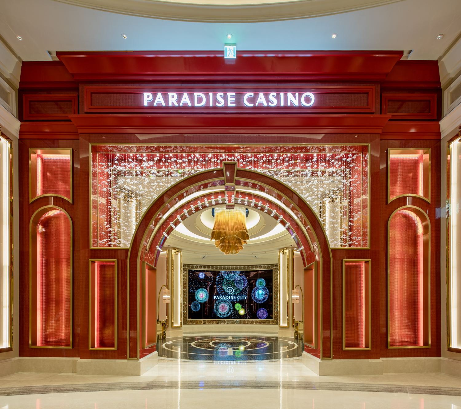 A vibrant casino interior featuring luxurious chandeliers, colorful slot machines, and stylish gaming tables, creating an energetic and glamorous atmosphere for guests seeking entertainment and excitement.