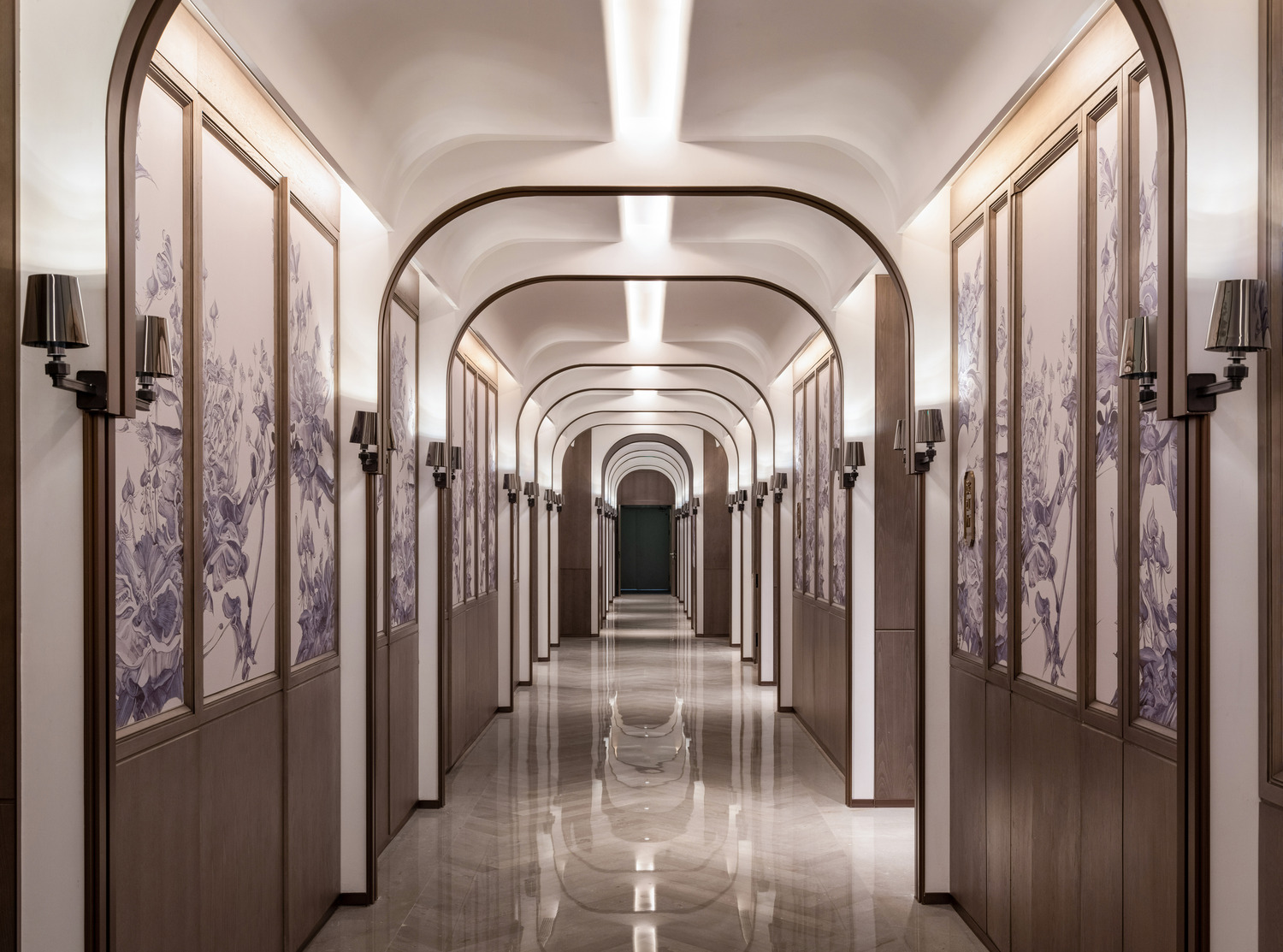 Modern hotel lobby with a sleek marble reception desk, vibrant teal and red shelving, elegant lighting, and a lush indoor tree. The space conveys luxury.