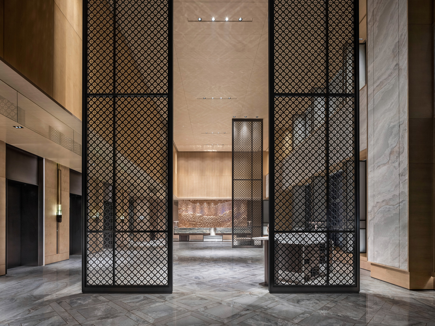 Modern hotel lobby with a sleek marble reception desk, vibrant teal and red shelving, elegant lighting, and a lush indoor tree. The space conveys luxury.