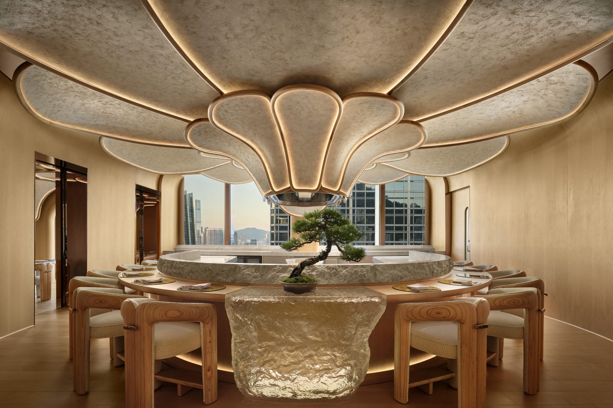 1. Elegant dining room with a nature-inspired ceiling resembling a flower, centered bonsai tree on stone table, wooden chairs, and cityscape view.