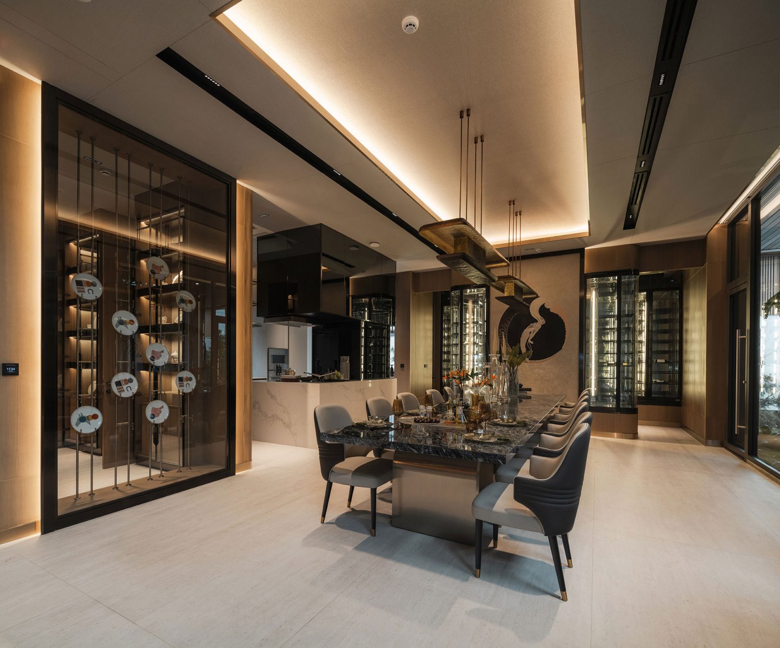 Luxurious dining room featuring a sleek marble table, modern chairs, elegant lighting, decorative plates in a glass cabinet, and ambient lighting.
